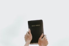 person-holding-holy-bible.jpg person holding Holy Bible